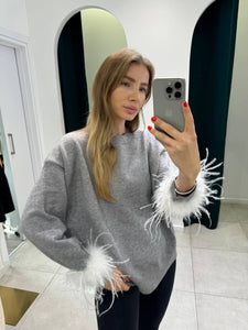 Sweater with feathers